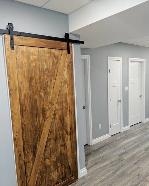 Renovated Basement With Wooden Sliding Door